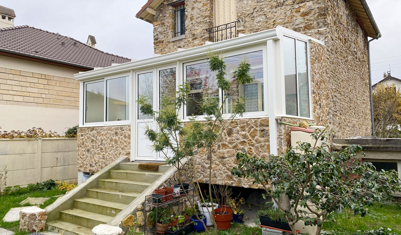 Véranda terrasse style traditionnel à Parmain (95)